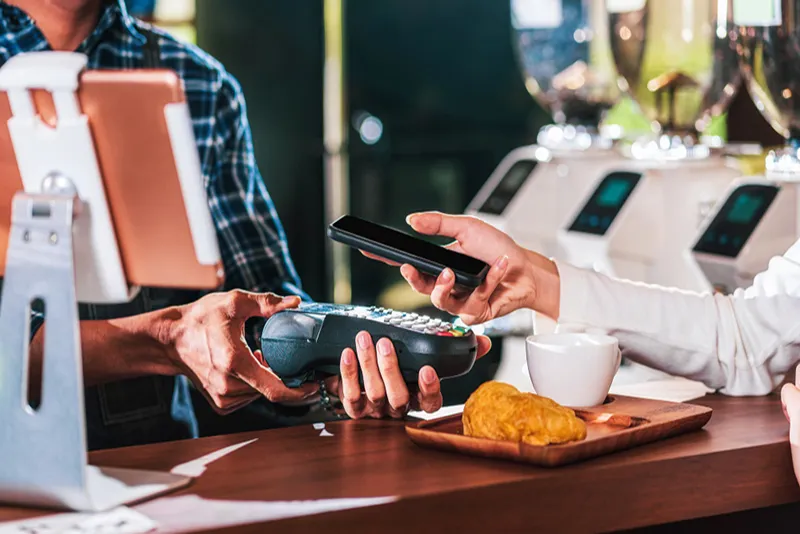 person paying with its smartphone wallet app